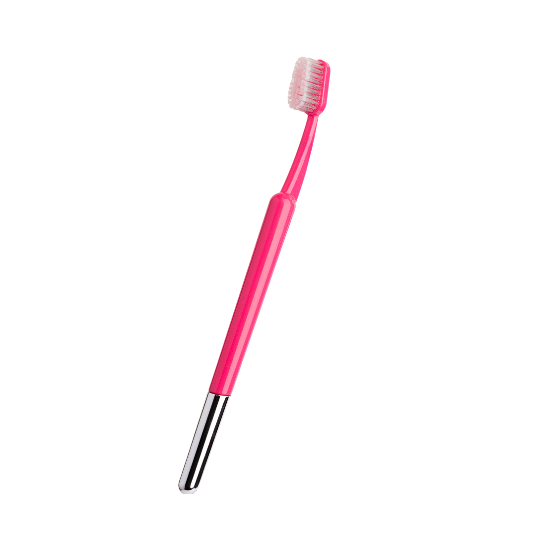 Tortoiseshell-patterned toothbrush with white bristles.